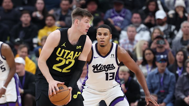 Oct 29, 2024; Salt Lake City, Utah, USA; Utah Jazz forward Kyle Filipowski (22) holds the ball while Sacramento Kings forward Keegan Murray (13) defends during the second quarter at Delta Center. Mandatory Credit: Rob Gray-Imagn Images Oct 29, 2024; Salt Lake City, Utah, USA; Utah Jazz forward Kyle Filipowski (22) holds the ball while Sacramento Kings forward Keegan Murray (13) defends during the second quarter at Delta Center. Mandatory Credit: Rob Gray-Imagn Images