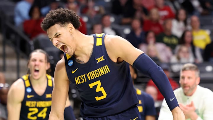 Mar 16, 2023; Birmingham, AL, USA; West Virginia Mountaineers forward Tre Mitchell (3) reacts after scoring a basket while being fouled against the Maryland Terrapins during the second half in the first round of the 2023 NCAA Tournament at Legacy Arena. Mandatory Credit: Vasha Hunt-Imagn Images
