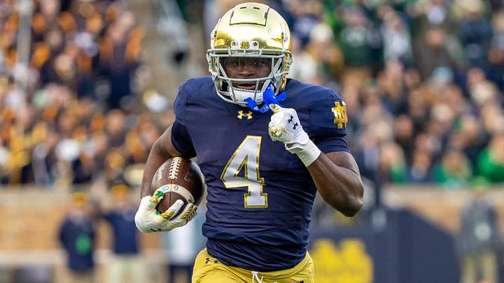Nov 22, 2025; South Bend, Indiana, USA; Notre Dame Fighting Irish running back Jeremiyah Love (4) runs the ball against the Syracuse Orange during the first half at Notre Dame Stadium. Mandatory Credit: Michael Caterina-Imagn Images