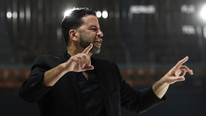 Alameda boys basketball coach Miles Tarver, dressed in fancier threads in honor of his former coach Frank LaPorte, maestros his team to a big win over Bishop O'Dowd on 2-14-2025 at the Henry J. Kaiser Center in Oakland as part of the Nike All-Star Weekend Future Games. 