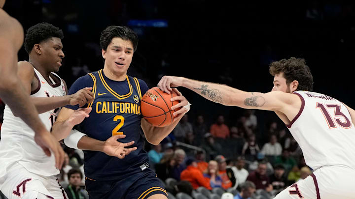 Mar 11, 2025; Charlotte, NC, USA; California Golden Bears guard Andrej Stojakovic (2) with the ball as Virginia Tech Hokies guard Tyler Johnson (10) and forward Ben Burnham (13) defend in overtime at Spectrum Center. Mandatory Credit: Bob Donnan-Imagn Images