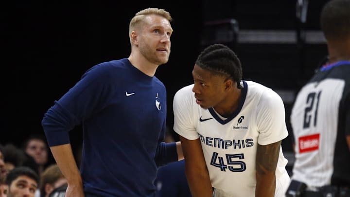 Oct 6, 2025; Memphis, Tennessee, USA; Memphis Grizzlies head coach Tuomas Iisalo talks with forward GG Jackson II (45) during the fourth quarter against the Detroit Pistons at FedExForum. Mandatory Credit: Petre Thomas-Imagn Images