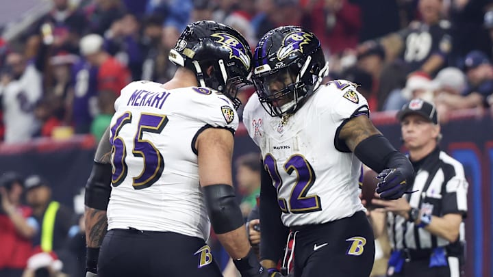 Dec 25, 2024; Houston, Texas, USA; Baltimore Ravens guard Patrick Mekari (65) celebrates  running back Derrick Henry (22) rushing touchdown against the Houston Texans  in the first quarter at NRG Stadium. Mandatory Credit: Thomas Shea-Imagn Images