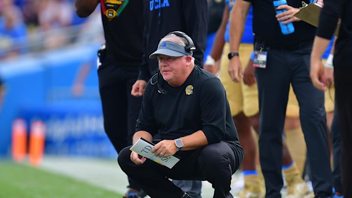 Sep 16, 2023; Pasadena, California, USA; UCLA Bruins head coach Chip Kelly watches game action against the North Carolina Central Eagles during the second half at Rose Bowl. Mandatory Credit: Gary A. Vasquez-Imagn Images Sep 16, 2023; Pasadena, California, USA; UCLA Bruins head coach Chip Kelly watches game action against the North Carolina Central Eagles during the second half at Rose Bowl. Mandatory Credit: Gary A. Vasquez-Imagn Images