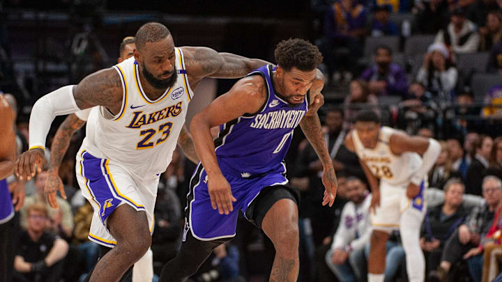 Dec 21, 2024; Sacramento, California, USA; Los Angeles Lakers forward LeBron James (23) and Sacramento Kings guard Malik Monk (0) fight for possession of the ball during the fourth quarter at Golden 1 Center. Mandatory Credit: Ed Szczepanski-Imagn Images Dec 21, 2024; Sacramento, California, USA; Los Angeles Lakers forward LeBron James (23) and Sacramento Kings guard Malik Monk (0) fight for possession of the ball during the fourth quarter at Golden 1 Center. Mandatory Credit: Ed Szczepanski-Imagn Images