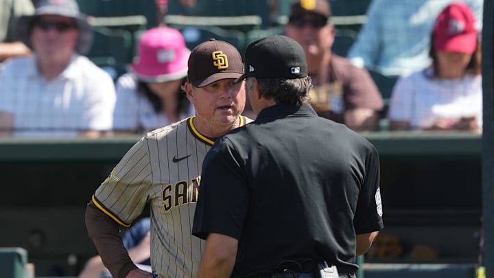Apr 9, 2025; West Sacramento, California, USA; San Diego Padres manager Mike Shildt (left) talks with home plate umpire James Hoye (92) during the ninth inning against the Athletics at Sutter Health Park. Mandatory Credit: Darren Yamashita-Imagn Images