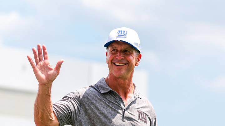 Aug 20, 2026; Miami Gardens, FL, USA; New York Giants head coach John Harbaugh reacts after joint practice with the Miami Dolphins at Baptist Health Training Complex. Mandatory Credit: Sam Navarro-Imagn Images
