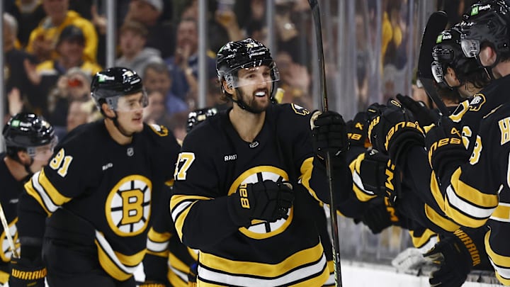 Oct 11, 2025; Boston, Massachusetts, USA; Boston Bruins center Mark Kastelic (47) is congratulated at the bench after scoring against the Buffalo Sabres during the second period at TD Garden. Mandatory Credit: Winslow Townson-Imagn Images