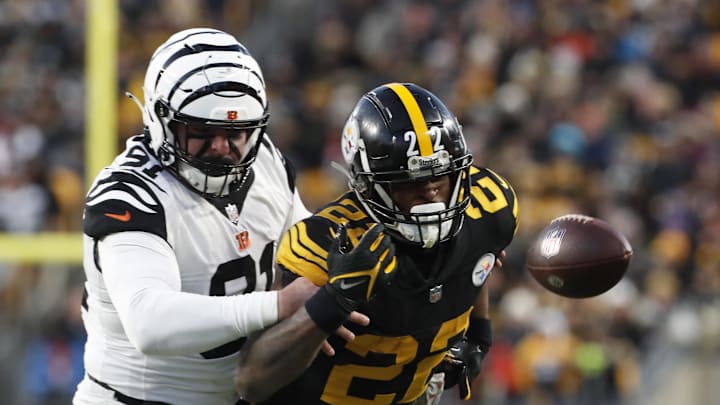 Nov 20, 2022; Pittsburgh, Pennsylvania, USA;  Cincinnati Bengals defensive end Trey Hendrickson (91) breaks up a pass intended for Pittsburgh Steelers running back Najee Harris (22) during the first quarter at Acrisure Stadium. Mandatory Credit: Charles LeClaire-Imagn Images