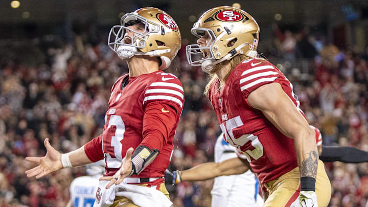December 30, 2024; Santa Clara, California, USA; San Francisco 49ers quarterback Brock Purdy (13) celebrates with tight end George Kittle (85) after scoring a touchdown against the Detroit Lions during the second quarter at Levi's Stadium. Mandatory Credit: Kyle Terada-Imagn Images