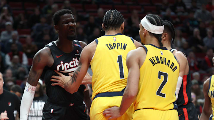 Feb 4, 2025; Portland, Oregon, USA; Portland Trail Blazers center Deandre Ayton (2) talks with Indiana Pacers forward Obi Toppin (1) and Pacers’ guard Andrew Nembhard (2)  in the second half at Moda Center. Mandatory Credit: Jaime Valdez-Imagn Images
