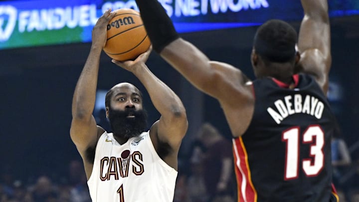 Mar 25, 2026; Cleveland, Ohio, USA; Cleveland Cavaliers guard James Harden (1) shoots beside Miami Heat center Bam Adebayo (13) in the third quarter at Rocket Arena. Mandatory Credit: David Richard-Imagn Images