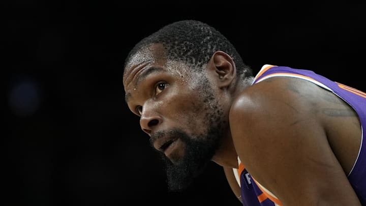 Mar 17, 2025; Phoenix, Arizona, USA; Phoenix Suns forward Kevin Durant (35) during a timeout in the second half against the Toronto Raptors at Footprint Center. Mandatory Credit: Rick Scuteri-Imagn Images
