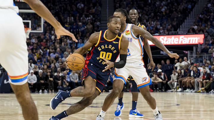 Nov 27, 2024; San Francisco, California, USA; Golden State Warriors forward Jonathan Kuminga (00) drives to the basket against the Oklahoma City Thunder during the fourth quarter at Chase Center. Mandatory Credit: John Hefti-Imagn Images