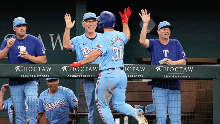 Apr 28, 2024; Arlington, Texas, USA; Texas Rangers designated hitter Wyatt Langford (36) celebrates