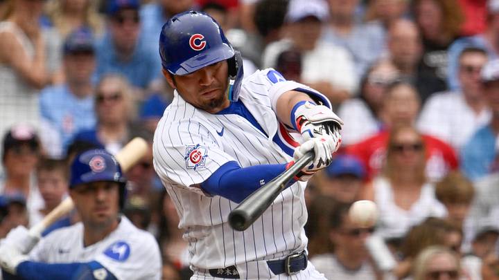 Aug 29, 2026; Chicago, Illinois, USA;  Chicago Cubs right fielder Seiya Suzuki (27) hits a single during the fourth inning against the Cincinnati Reds at Wrigley Field.  Mandatory Credit: Matt Marton-Imagn Images