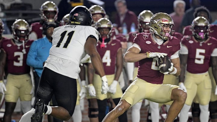 Nov 1, 2025; Tallahassee, Florida, USA; Florida State Seminoles wide receiver Duce Robinson (0) runs with the ball during the first half against the Wake Forest Demon Deacons at Doak S. Campbell Stadium. Mandatory Credit: Melina Myers-Imagn Images
