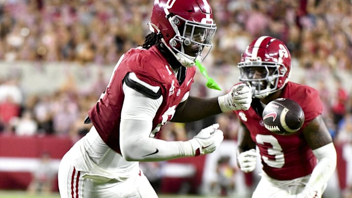 Sep 28, 2024; Tuscaloosa, Alabama, USA;  Alabama Crimson Tide linebacker Deontae Lawson (0) breaks up a pass by Georgia Bulldogs quarterback Carson Beck (15) at Bryant-Denny Stadium. Mandatory Credit: Gary Cosby Jr.-Imagn Images