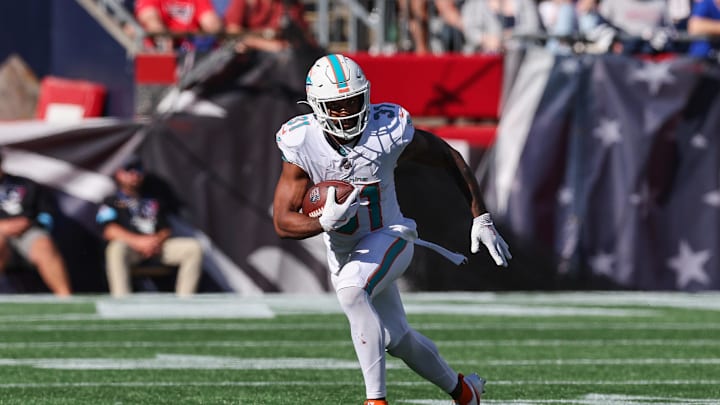 Oct 6, 2024; Foxborough, Massachusetts, USA; Miami Dolphins running back Raheem Mostert (31) rushes the ball during the second half against the New England Patriots at Gillette Stadium. Oct 6, 2024; Foxborough, Massachusetts, USA; Miami Dolphins running back Raheem Mostert (31) rushes the ball during the second half against the New England Patriots at Gillette Stadium.