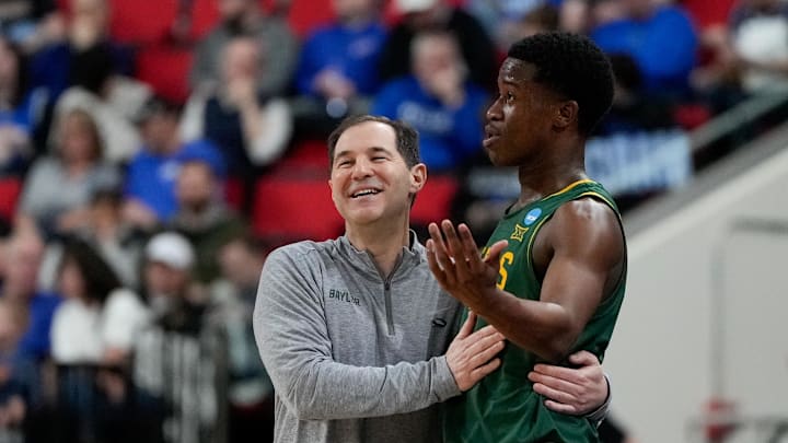 Mar 21, 2025; Raleigh, NC, USA; Baylor Bears head coach Scott Drew speaks with guard VJ Edgecombe (7) during the first half in the first round of the NCAA Tournament at Lenovo Center. Mandatory Credit: Bob Donnan-Imagn Images