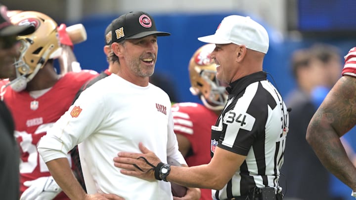 Sep 22, 2024; Inglewood, California, USA;  San Francisco 49ers head coach Kyle Shanahan talks with referee Clete Blakeman (34) prior to the game against the Los Angeles Rams at SoFi Stadium. Mandatory Credit: Jayne Kamin-Oncea-Imagn Images