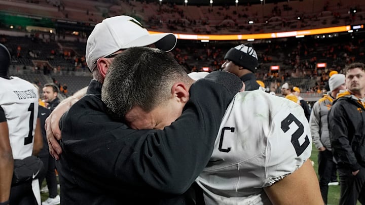Vanderbilt quarterback Diego Pavia (2) is embraced by Senior Offensive Advisor Jerry Kill after defeating Tennessee at Neyland Stadium in Knoxville, Tenn., Saturday, Nov. 29, 2025.