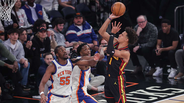 Jan 2, 2026; New York, New York, USA;  Atlanta Hawks forward Jalen Johnson (1) shoots past New York Knicks center Ariel Hukporti (55) and forward Og Anunoby (8) in the first quarter at Madison Square Garden. Mandatory Credit: Wendell Cruz-Imagn Images