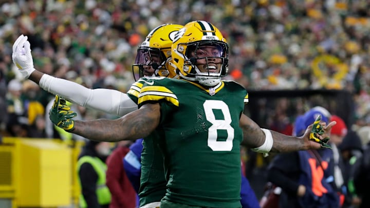 Green Bay Packers running back Josh Jacobs (8) celebrates scoring a touchdown with wide receiver Bo Melton (80) against the San Francisco 49ers during their football game Sunday, November 24, 2024, at Lambeau Field in Green Bay, Wisconsin. Green Bay Packers running back Josh Jacobs (8) celebrates scoring a touchdown with wide receiver Bo Melton (80) against the San Francisco 49ers during their football game Sunday, November 24, 2024, at Lambeau Field in Green Bay, Wisconsin.