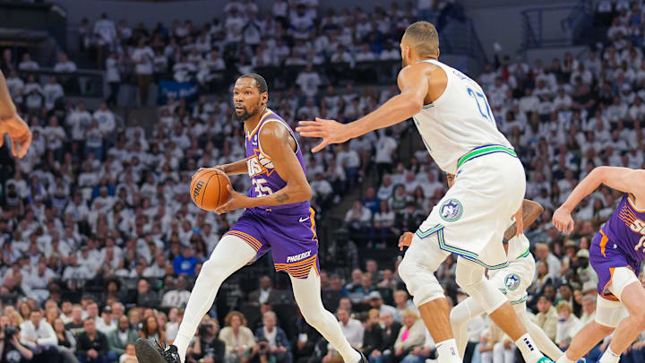Apr 23, 2024; Minneapolis, Minnesota, USA; Phoenix Suns forward Kevin Durant (35) dribbles against Minnesota Timberwolves center Rudy Gobert (27) in the second quarter during game two of the first round for the 2024 NBA playoffs at Target Center. Mandatory Credit: Brad Rempel-Imagn Images Apr 23, 2024; Minneapolis, Minnesota, USA; Phoenix Suns forward Kevin Durant (35) dribbles against Minnesota Timberwolves center Rudy Gobert (27) in the second quarter during game two of the first round for the 2024 NBA playoffs at Target Center. Mandatory Credit: Brad Rempel-Imagn Images