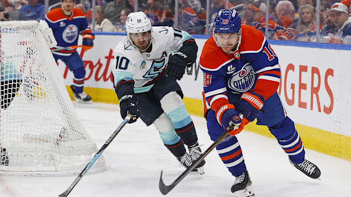 Mar 31, 2026; Edmonton, Alberta, CAN; Edmonton Oilers forward Zach Hyman (18) and Seattle Kraken forward Matty Beniers (10) chase a loose puck during the third period at Rogers Place. Mandatory Credit: Perry Nelson-Imagn Images Mar 31, 2026; Edmonton, Alberta, CAN; Edmonton Oilers forward Zach Hyman (18) and Seattle Kraken forward Matty Beniers (10) chase a loose puck during the third period at Rogers Place. Mandatory Credit: Perry Nelson-Imagn Images