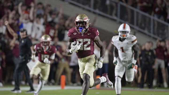 Oct 4, 2025; Tallahassee, Florida, USA; Florida State Seminoles running back Ousmane Kromah (32) runs during the first half against the Miami Hurricanes at Doak S. Campbell Stadium. Mandatory Credit: Melina Myers-Imagn Images