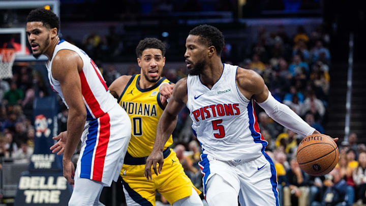 Nov 29, 2024; Indianapolis, Indiana, USA; Detroit Pistons guard Malik Beasley (5) dribbles the ball while Indiana Pacers guard Tyrese Haliburton (0) defends: Trevor Ruszkowski-Imagn Images