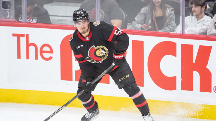 Sep 26, 2024; Ottawa, Ontario, CAN; Ottawa Senators right wing Tyler Boucher (54) controls the puck in the third period against the Buffalo Sabres at the Canadian Tire Centre. Mandatory Credit: Marc DesRosiers-Imagn Images
