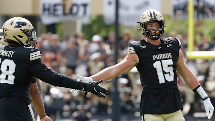 Purdue Boilermakers defensive lineman Demeco Kennedy (18) high-fives Purdue Boilermakers defensive end Will Heldt (15) Saturday, Aug. 31, 2024, during the NCAA football game against the Indiana State Sycamores at Ross-Ade Stadium in West Lafayette, Ind. Purdue Boilermakers won 49-0.