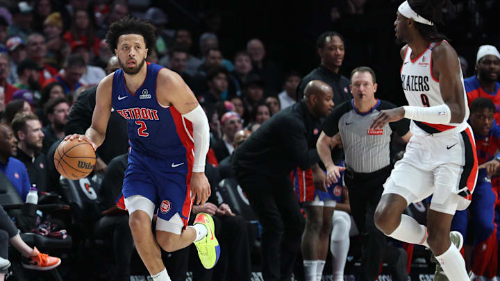 Mar 9, 2025; Portland, Oregon, USA;  Detroit Pistons guard Cade Cunningham (2) brings the ball up the court past Portland Trail Blazers forward Jerami Grant (9) in the second half at Moda Center. Mandatory Credit: Jaime Valdez-Imagn Images