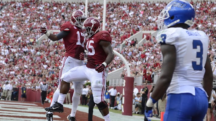 Oct 5, 2013; Tuscaloosa, AL, USA; Alabama Crimson Tide running back Jalston Fowler (45) celebrates his touchdown with running back Kenyan Drake (17) in the end zone against the Georgia State Panthers during the second quarter at Bryant-Denny Stadium. 