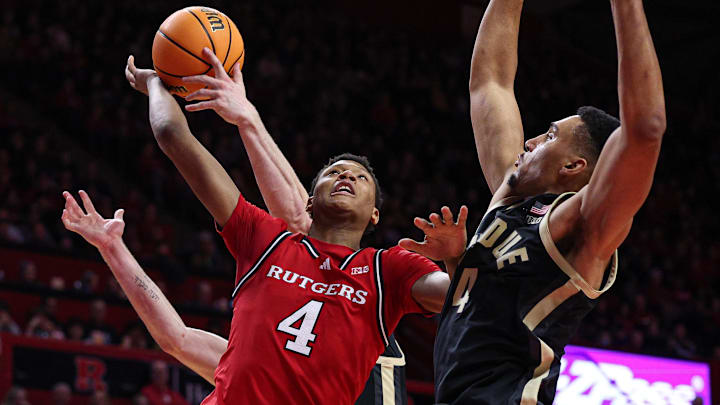 Purdue Boilermakers forward Caleb Furst (1) blocks a shot by Rutgers Scarlet Knights guard Ace Bailey (4) 