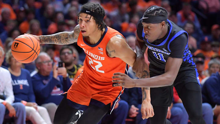 Nov 4, 2024; Champaign, Illinois, USA; Illinois Fighting Illini guard Tre White (22) drives the ball as Eastern Illinois Panthers guard Malik Olafioye (11) guards him during the first half at State Farm Center. Mandatory Credit: Ron Johnson-Imagn Images Nov 4, 2024; Champaign, Illinois, USA; Illinois Fighting Illini guard Tre White (22) drives the ball as Eastern Illinois Panthers guard Malik Olafioye (11) guards him during the first half at State Farm Center. Mandatory Credit: Ron Johnson-Imagn Images