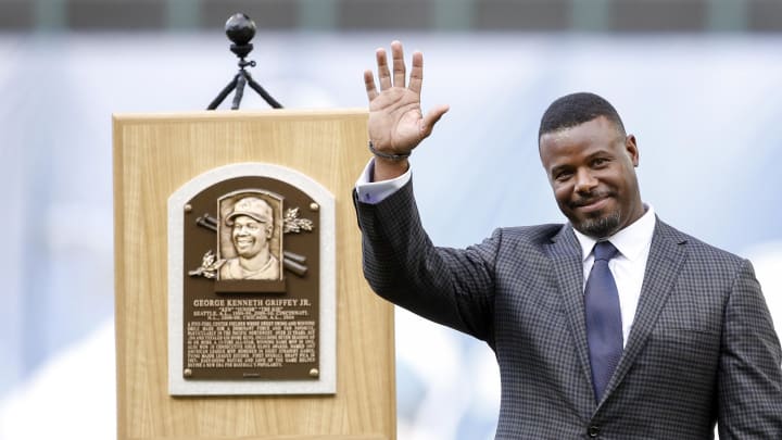 Seattle Mariners former player Ken Griffey Jr. smiles next to his Hall of Fame plaques during his number retirement ceremony before the start of a game against the Los Angeles Angels at Safeco Field in 2016. Seattle Mariners former player Ken Griffey Jr. smiles next to his Hall of Fame plaques during his number retirement ceremony before the start of a game against the Los Angeles Angels at Safeco Field in 2016.