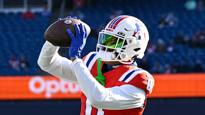 Dec 1, 2024; Foxborough, Massachusetts, USA; New England Patriots cornerback Christian Gonzalez (0) warms up before a game against the Indianapolis Colts at Gillette Stadium. Mandatory Credit: Eric Canha-Imagn Images