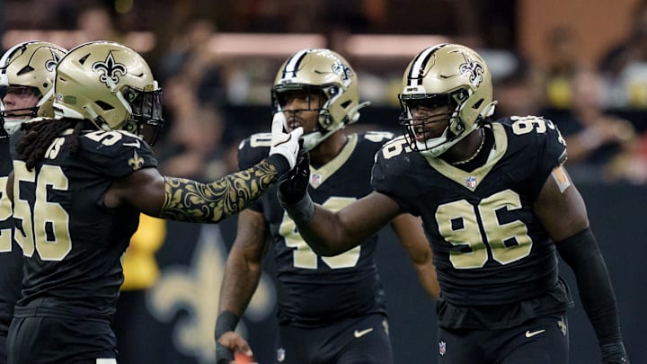 Sep 14, 2025; New Orleans, Louisiana, USA; New Orleans Saints defensive end Carl Granderson (96) reacts after tackling San Francisco 49ers quarterback Mac Jones (not shown) with linebacker Demario Davis (56) during the first half at Caesars Superdome. Mandatory Credit: Matthew Hinton-Imagn Images Sep 14, 2025; New Orleans, Louisiana, USA; New Orleans Saints defensive end Carl Granderson (96) reacts after tackling San Francisco 49ers quarterback Mac Jones (not shown) with linebacker Demario Davis (56) during the first half at Caesars Superdome. Mandatory Credit: Matthew Hinton-Imagn Images