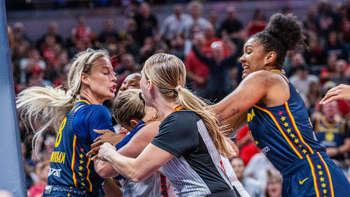 Indiana Fever guard Sophie Cunningham (8) and Connecticut Sun guard Jacy Sheldon (4) get into a fight in the second half at Gainbridge Fieldhouse. 
