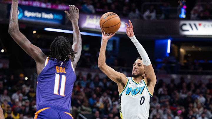 Jan 4, 2025; Indianapolis, Indiana, USA; Indiana Pacers guard Tyrese Haliburton (0)  shoots the ball against Phoenix Suns center Bol Bol (11) in the second half at Gainbridge Fieldhouse. Mandatory Credit: Trevor Ruszkowski-Imagn Images
