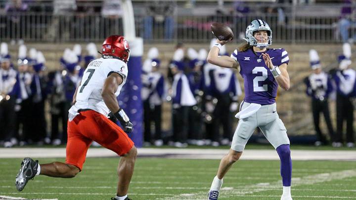Nov 23, 2024; Manhattan, Kansas, USA; Kansas State Wildcats quarterback Avery Johnson (2) passes the ball against Cincinnati Bearcats linebacker Jared Bartlett (7) during the second quarter at Bill Snyder Family Football Stadium. Mandatory Credit: Scott Sewell-Imagn Images Nov 23, 2024; Manhattan, Kansas, USA; Kansas State Wildcats quarterback Avery Johnson (2) passes the ball against Cincinnati Bearcats linebacker Jared Bartlett (7) during the second quarter at Bill Snyder Family Football Stadium. Mandatory Credit: Scott Sewell-Imagn Images