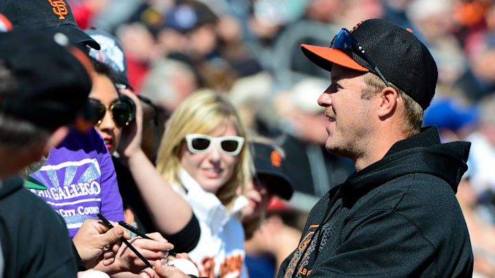 Feb. 24, 2013; Mesa, AZ, USA; San Francisco Giants former player Jeff Kent signs autographs for fans prior to the game against the Chicago Cubs at Hohokam Park. The Cubs won 4-3.  Mandatory Credit: Matt Kartozian-Imagn Images