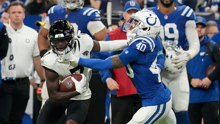 Jacksonville Jaguars wide receiver Brian Thomas Jr. (7) pushes off of Indianapolis Colts cornerback Jaylon Jones (40) on Sunday, Jan. 5, 2025, during a game against the Jacksonville Jaguars at Lucas Oil Stadium in Indianapolis.