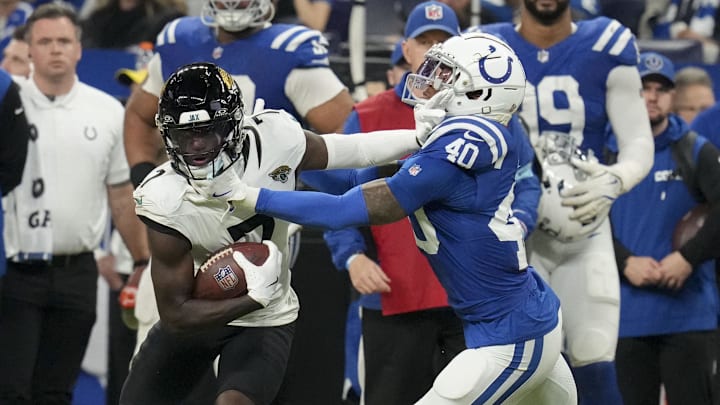Jan 5, 2025; Indianapolis, Indiana, USA; Jacksonville Jaguars wide receiver Brian Thomas Jr. (7) pushes off of Indianapolis Colts cornerback Jaylon Jones (40) during a game against the Jacksonville Jaguars at Lucas Oil Stadium. 