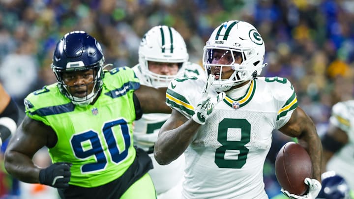 Dec 15, 2024; Seattle, Washington, USA; Green Bay Packers running back Josh Jacobs (8) rushes against the Seattle Seahawks during the first quarter at Lumen Field. Mandatory Credit: Joe Nicholson-Imagn Images
