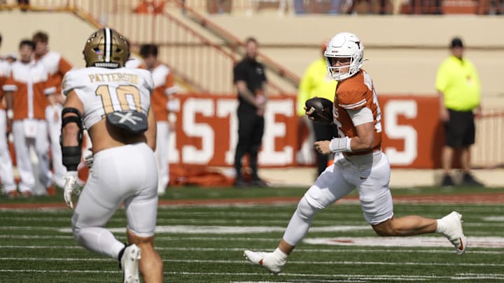 Texas Longhorns quarterback Arch Manning runs the ball during the first half against the Vanderbilt Commodores.
