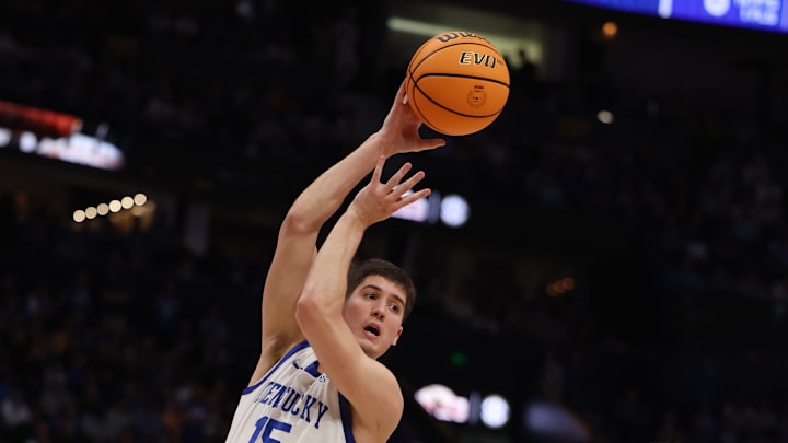 Kentucky Wildcats guard Reed Sheppard (15) passes the ball past Texas A&M Aggies guard Wade